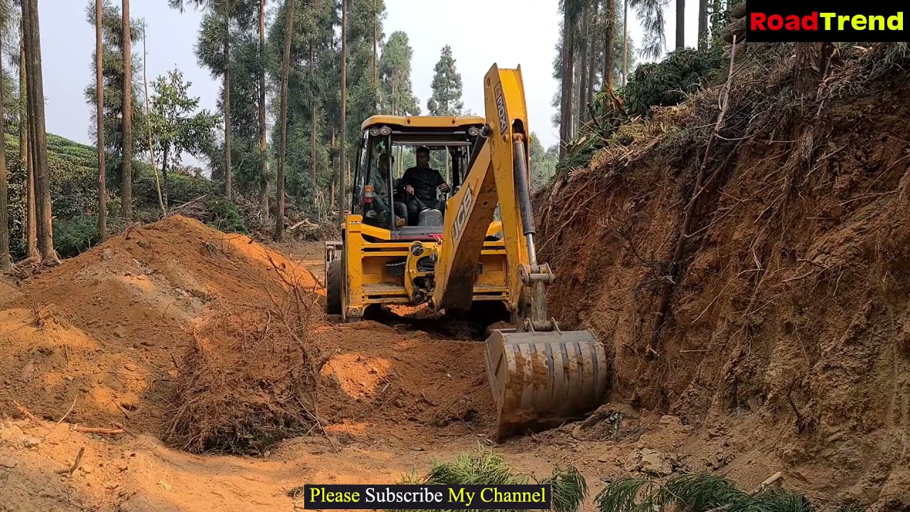 JCB loader  pushing  sloppy hill mud