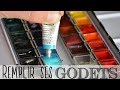 Remplir ses godets d'aquarelle