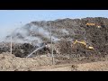 Delhi fire service spreading water on Asia’s Largest Garbage Mountain New Delhi