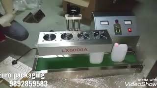 Induction sealer conveyor