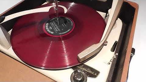 Silvertone 3 speed automatic record player playing a couple LP, 33.3 RPM records.