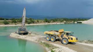 Liebherr HS 8100 loading Doosan and Volvo Dumpers