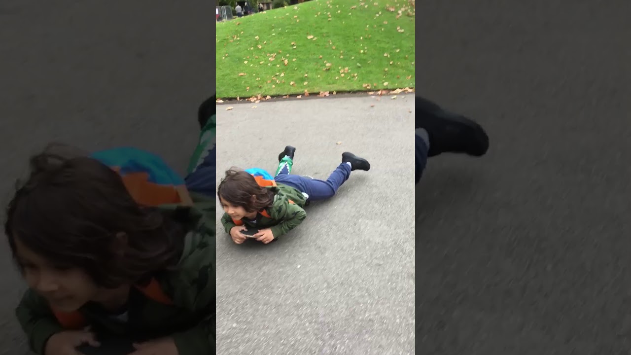 Fun Kid Johar Skateboarding down hill Kensington Gardens London