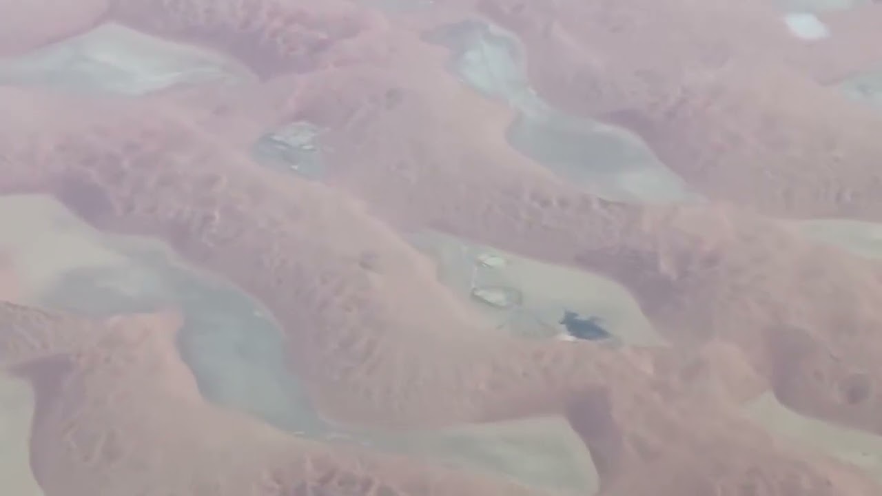 Flight over the vast Middle Eastern desert — endless sands beneath the wings
