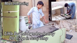 most interesting little boy hard worker destroy old fridge in scrap shop