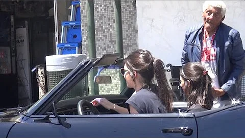 EXCLUSIVE - Kendall Jenner Stops Muscle Car To Feed Homeless Man