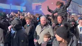 Stockport County fans marching  to a match against Stevenage