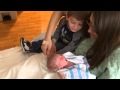 Big brother Mason meeting little sister Brianna for the first time