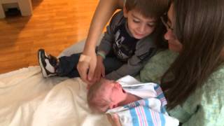 Big brother Mason meeting little sister Brianna for the first time