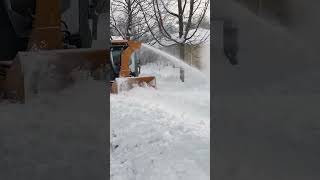 When sidewalks disappear under deep snow, the Trackless Twin Auger Snowblower gets to work!