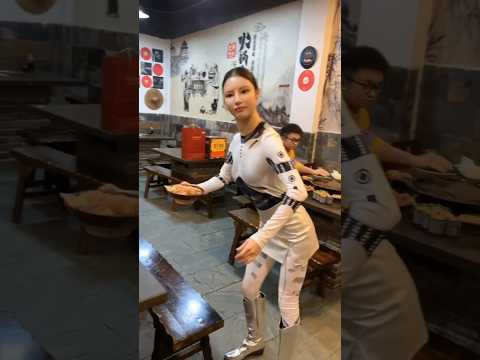 A Realistic Chinese Robot Waiter Enhances Dining Experience in a Chongqing Hotpot Restaurant