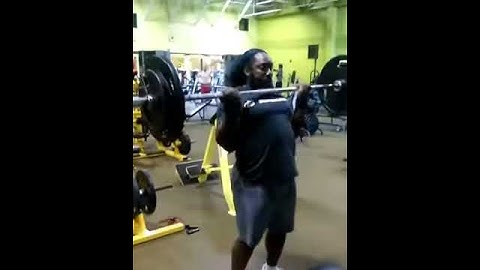 Demonstrating Barbell Cheat Curls With 185lbs.