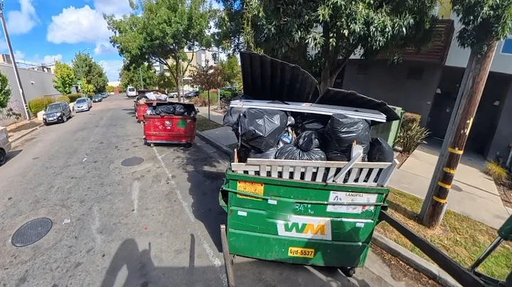 Waste Management front load commercial garbage truck 