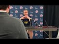 Caitlin Clark speaks to the media before Indiana Fever vs Chicago Sky + Fever players warm up