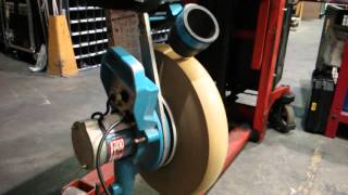 Simon Roberts and Will Belbin repairing pitching machine