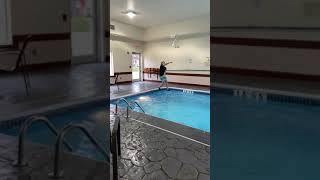 Slow mo jumping into pool.