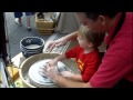 Wheel Throwing Pottery with tiny helper at Art In The Square