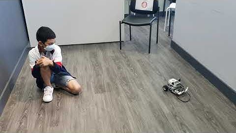 Pierre demonstrates the Buffalo Bumper car he built and programmed