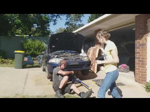 Teaching my teenage daughter how to do an oil change and basic safety working under a car