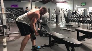 Stagger Stance Dumbbell Row