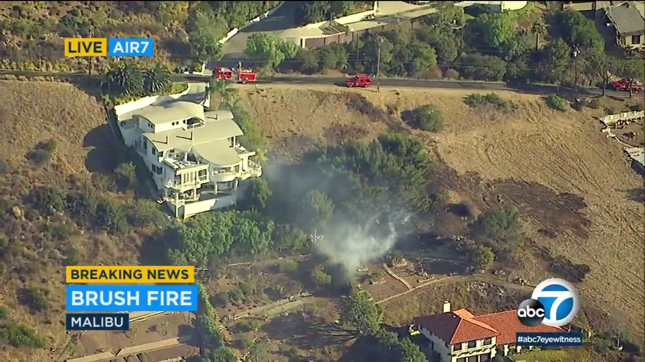 2nd-alarm brush fire briefly threatens structures in Malibu - YouTube
