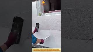 Skilled Worker Smoothing Cement Wall Using Trowel for Final Finish