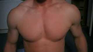 Young Bodybuilder Practices Pec Control And Poses