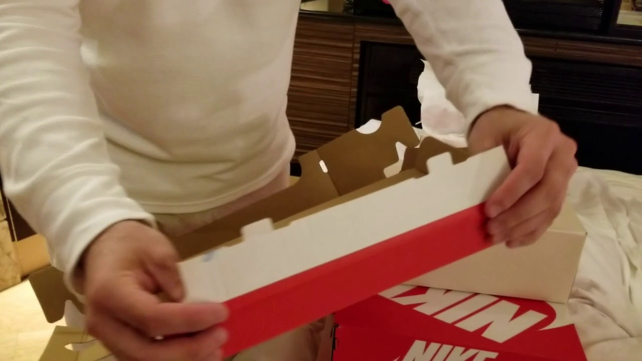 UNFOLDING AND FOLDING A NIKE SHOE BOX 