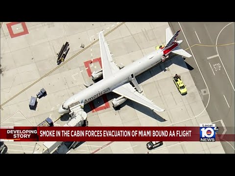 Listen to flight deck call after fire prompts evacuation of American Airlines flight to Miami