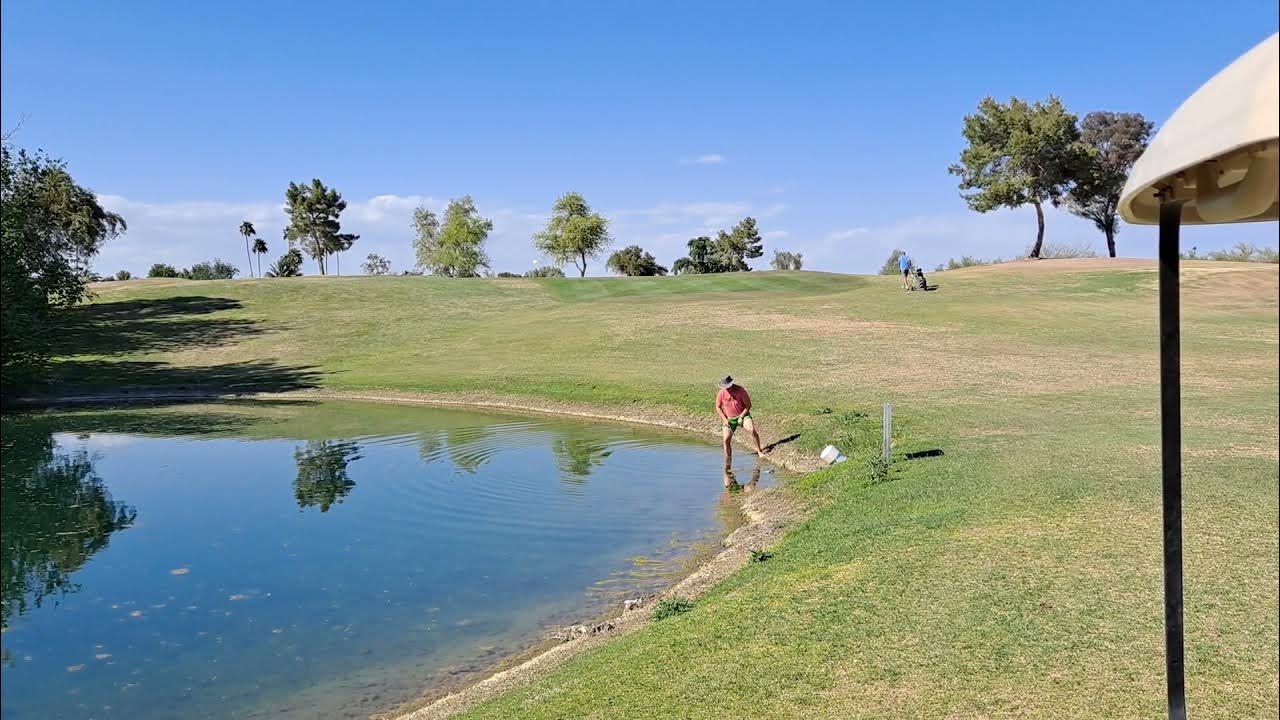 Incredible golf ball recovery from pond as golfer risks drowning and