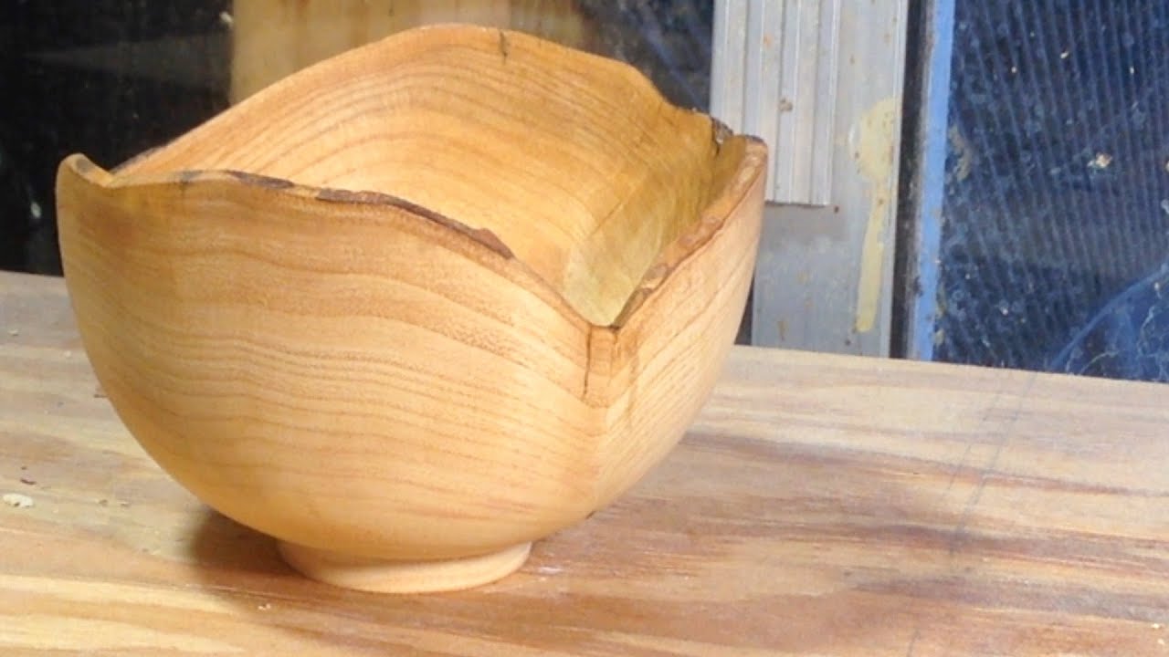 Richard Raffan turns a natural edge bowl in claret ash.