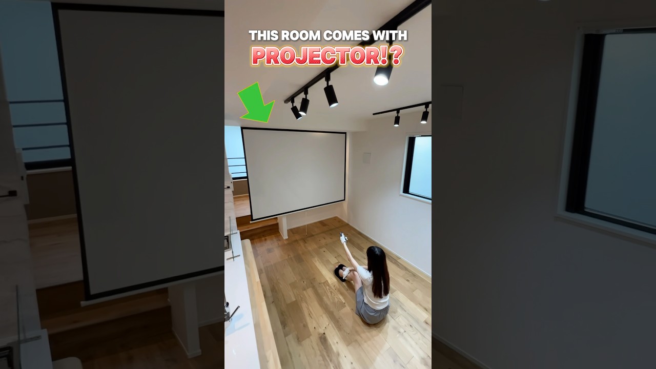 A room with a projector that's perfect for couples living together