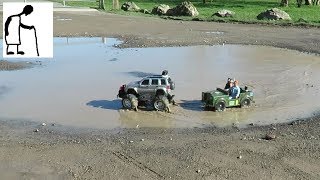 RC FastLane Jeep Cherokee and Action Man Jeep play in a puddle