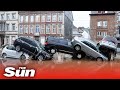 Belgium floods - Torrent of floodwater washes away cars