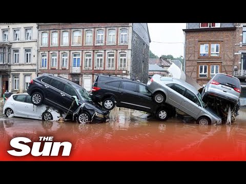 Belgium floods - Torrent of floodwater washes away cars.