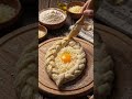 Molten Perfection 🧀🥚✨#khachapuri #cheesepull #eggs #foodshorts #asmr #artisanbread #shorts #foodie
