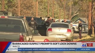 Schools placed under lockdown during police standoff