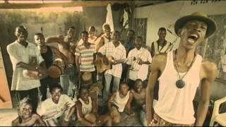 Baloji with Konono N°1 - Karibu Ya Bintou
Karibu Ya Bintou by Baloji
From the album Kinshasa Succursale
Label : Crammed discs
Shot in the streets of Kinshasa, DRC, Karibu Ya Bintou (Welcome to Life in Limbo) is a short film with music from the album Kinshasa Succursale by Baloji.
Electric thumb piano (likembé) played by Konono N°1, the legendary Congolese band whose junkyard sonics and trademark Congotronics sound has had a major influence on the electronic and indie rock scenes.
Buy/stream: http://smarturl.it/Kinshasasuccursale
Music :
Composition & Lyrics: Baloji Tshiani
Thanks to Konono N°1
Arrangements: Betis Didier Likeng / Cyril Harrison
Universal Music Publishing - Kléa Songs
Short film
Directors: Spike and Jones
DOP: Nicolas Karakatsanis
Producer: Annemie Decorte (Dr. Film)
Styling: Ann Lauwerys
Mask: Katrien Matthys
More info : http://www.crammed.be
http://www.baloji.com
Live dates : http://www.crammed.be/index.php?id=31#185 Baloji with Konono N°1 - Karibu Ya Bintou