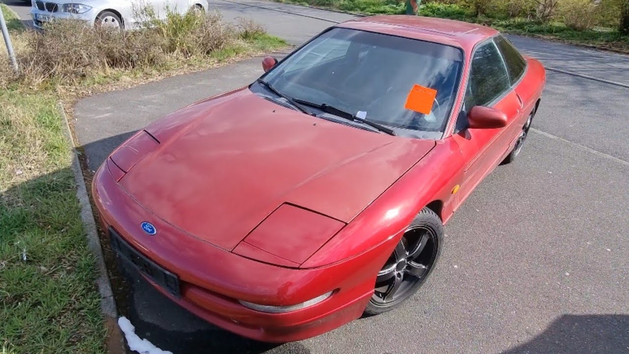 Justus Unterwegs ein verlassener schöner roter Ford Probe 24V (1992–1997) Generation 2.  Sportcoupé