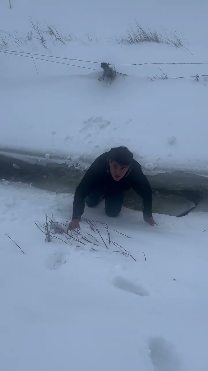 Man Fall Through Ice on Frozen Stream || ViralHog