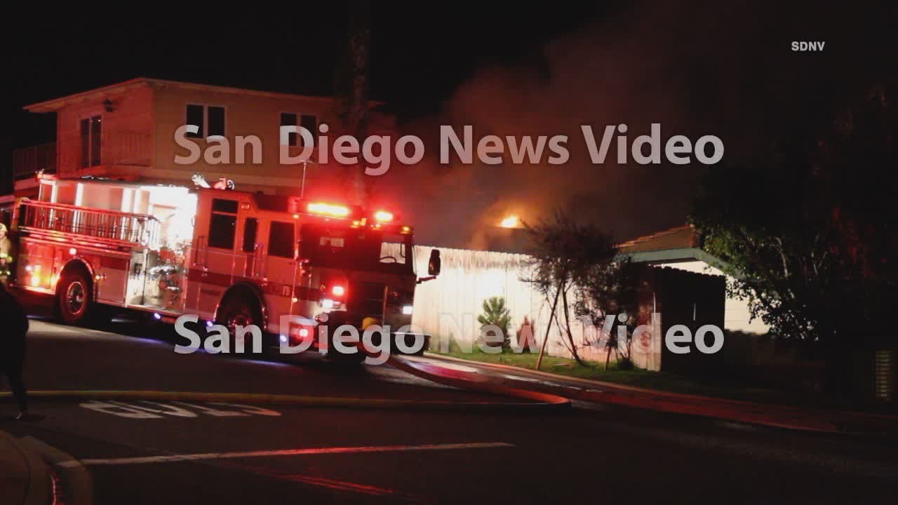 Flames destroy trailer in backyard of home - YouTube