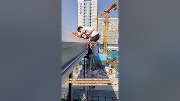 The Daring Descent of a Window Cleaner
