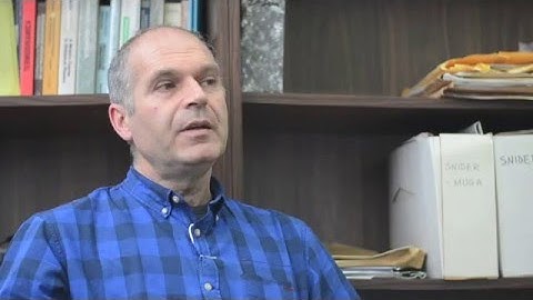 Shortcuts to adiabaticity for an ion in a rotating radially tight trap