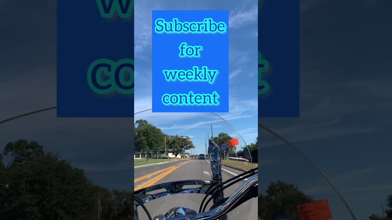 Cruiser Motorcycle rider follows freight train