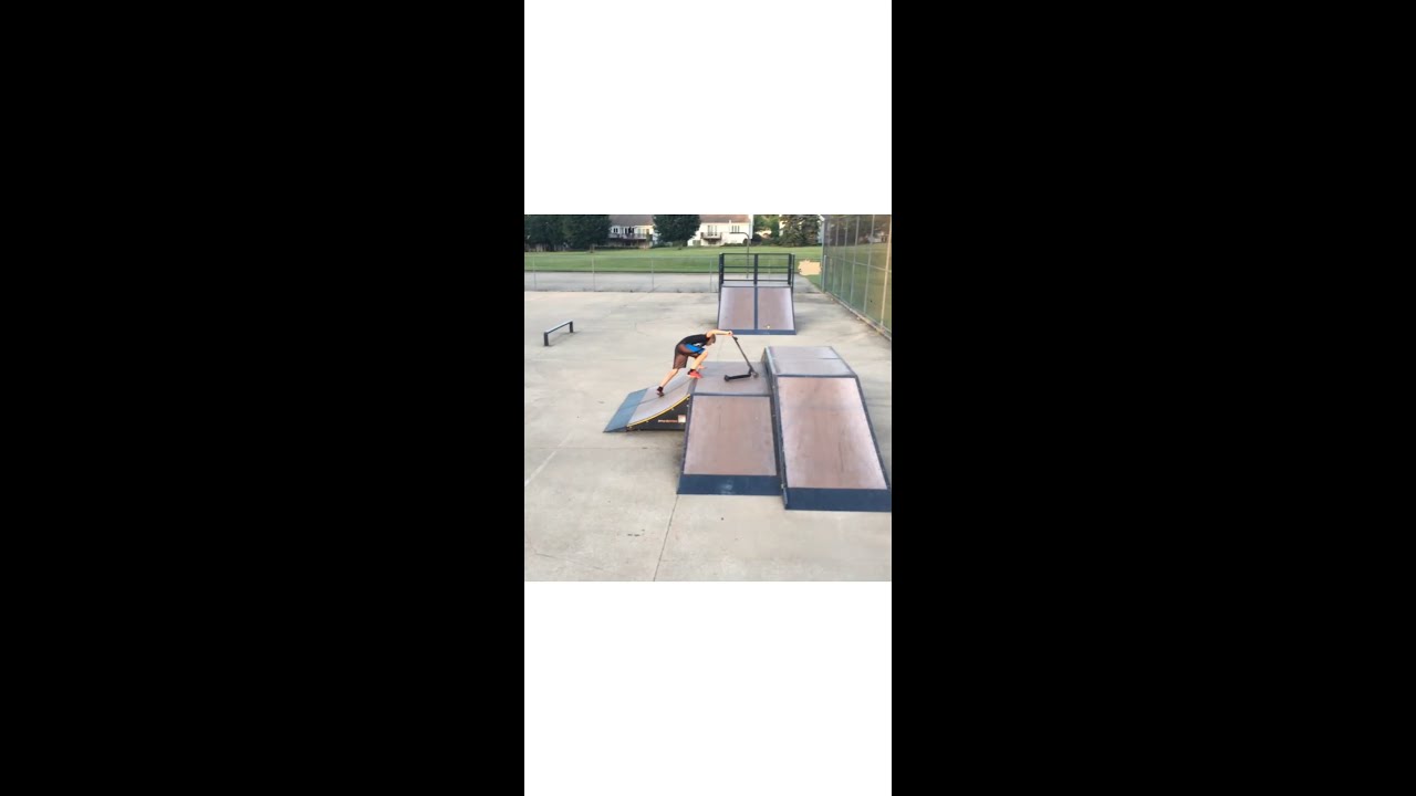 Kid falls off scooter at skate park! - YouTube