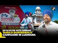 On his scooter with gunman, Independent LS Candidate “Babaji Burgerwala” takes to street in Ludhiana