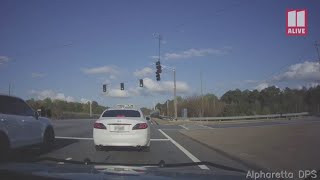 Dashcam video shows suspected drug dealer DUI suspect drag officer in car