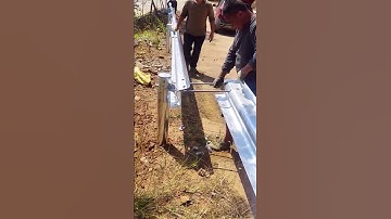 Highway guardrail construction- Good tools and machinery make work easy