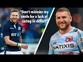 Finn Russell smiling after making a mistake