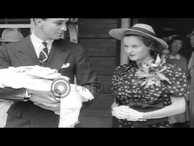 Franklin Delano Roosevelt, Junior and his wife walk out of a hospital with their ...HD Stock Footage class=